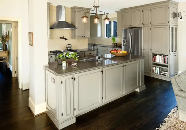 Remodeled Atlanta kitchen with a long island, stainless hood, and dark hardwood floors